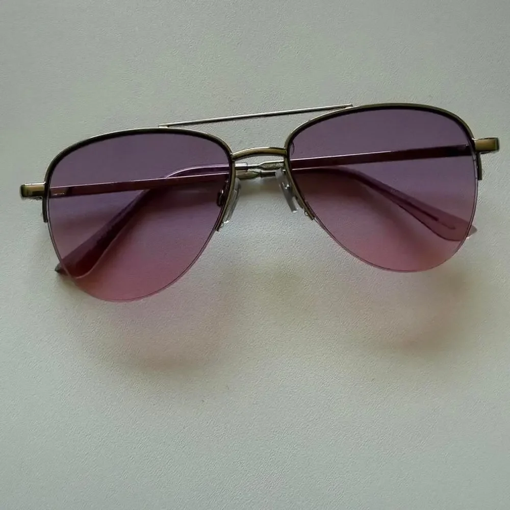 Gold aviator sunglasses with purple